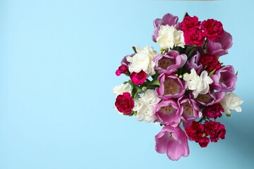 Beautiful bouquet of fresh flowers on a color background