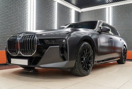 Black Matte BMW 7-Series 750e G70 xDrive in showroom. Exterior BMW 750e a premium limousine, luxury sedan manufactured by the German automobile manufacturer BMW. 