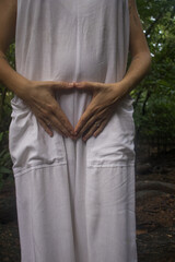 Woman connecting to mother earth and her feminine energy