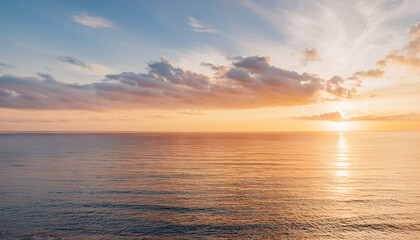 Stunning Seascape Background: Golden Sunrise or Sunset Over Calm Ocean Waters with Colorful Sky and Reflective Light Path - Perfect for Travel, Wellness, and Inspirational Designs