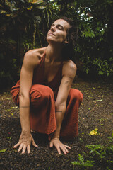 Woman connecting to mother earth and her feminine energy