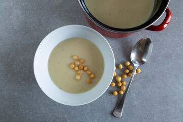 Creamy celery soup served with crispy croutons  