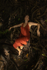 Woman connecting to mother earth and her feminine energy
