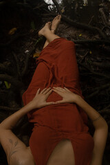 Woman connecting to mother earth and her feminine energy