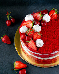 Red Velvet cake with fruit decorated on a dark background