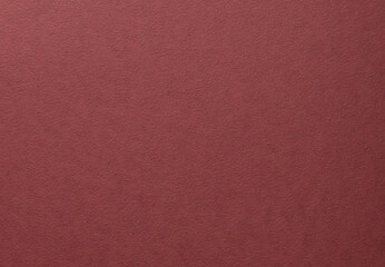 Deep burgundy paper background with a matte, grainy texture and subtle fibrous surface. Rich red tones create an elegant, minimalistic design, perfect for luxury stationery and premium artistic.