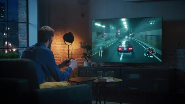 Man Plays an Arcade Racing Game on a TV with Console, Driving Through Neon-lit City Streets, Drifting Through Tunnels, and Achieving Victory in a Multiplayer Battle. Mock-up Video Game Simulator