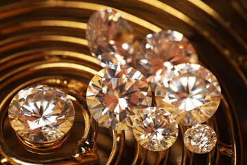 Beautiful shiny gemstones on golden tray, closeup