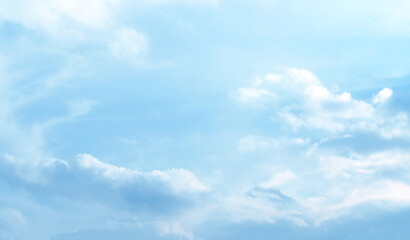 Blue pastel sky with white fluffy cloud. Cumulus clouds background. Cloudscape morning sky. The concepts of freedom of life, never give up and positive though energy.