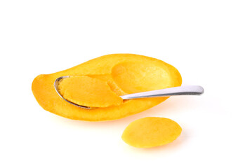 Ripe mangoes cut in half and stainless spoon isolated on white background