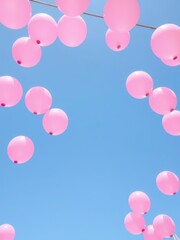  Pink Balloon Decoration Floating Against a Clear Blue Sky for a Festive Celebration