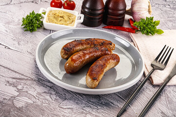 Delicous natural roasted sausages in the plate