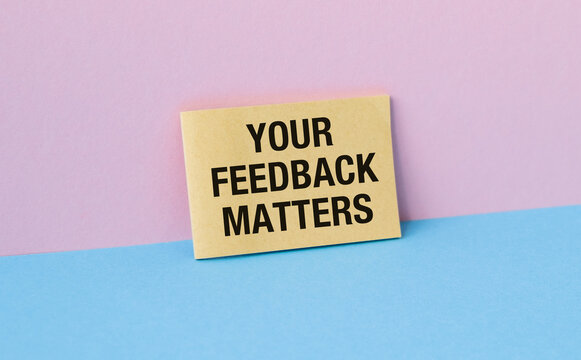 Feedback concept. Paper Card with text Your feedback matters on pink background. Message symbol about client review, constructive opinion, business support.