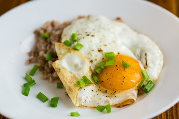 Appetizing dish with egg and boiled buckwheat