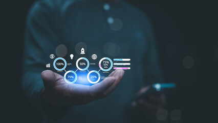 Person Is Holding Series Of Infographic Circles Hovering Above Their Hand, They Are Also Holding Smartphone In Their Other Hand