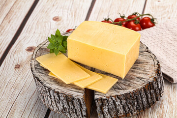 Yellow cheese piece with slices