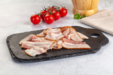 Raw pork tenferloin with bacon
