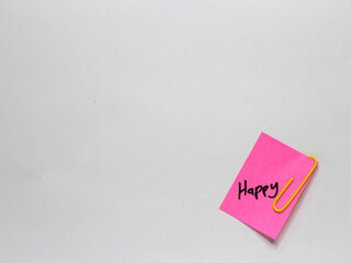 Sticky note with positive words written on a white background. Motivational word photo concept. Happy.
