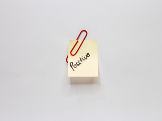 Sticky note with positive words written on a white background. Motivational word photo concept. Positive.