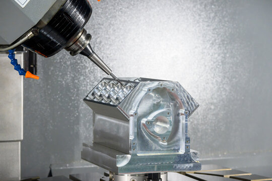 The 5-axis CNC milling machine cutting the aluminum engine block by solid ball nose end mill tool.