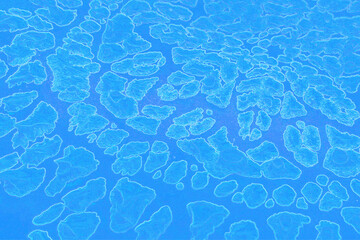 Blue is a mesmerizing abstract image of outer space. The destruction of the galaxy. The celestial constellation. Floating rocks, craters. Snowflake.  Sense of cosmic mystery and wonder.