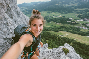 Smiling woman climber on mountaintop selfie amazing view green valley rock girl happy sport summer