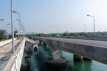 Fototapeta premium Sarasin Bridge is bridge connecting Phuket Island with mainland Thailand over Pak Kra Strait. Pedestrian part of bridge with stairways