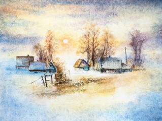 Village in winter sunset