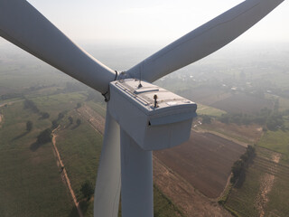 Wind turbines generate electricity at sunset in Europe and Asia
