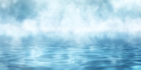 Calm blue water reflecting foggy sky; serene background