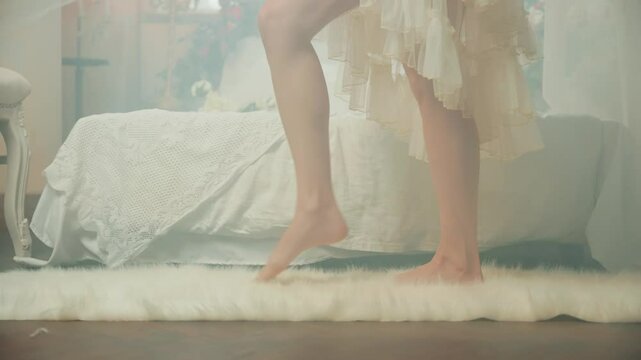 girl princess sexy long legs bare feet close-up walk on fluffy carpet artificial white fur skin on floor near bed. Fairy tale noble lady. Fantasy woman elf queen white room Victorian old style art 4k