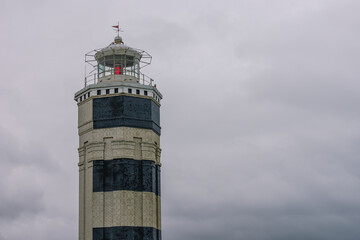 A coastal lighthouse, which is used to mark the shores and determine the location of the vessel. A coastal landmark. A lighthouse located in Anapa, Russia, on the shores of the Black Sea.