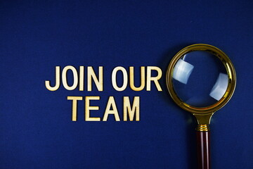 Join Our Team alphabet letters with magnifying glass on navy blue background
