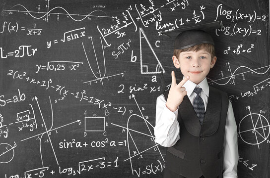 young man writing on blackboard
