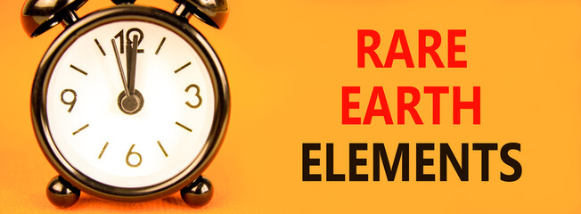 Rare earth elements symbol. Concept words Rare earth elements on beautiful orange paper. Alarm...