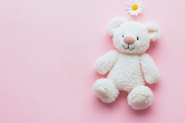 White teddy bear and daisy on pink background.