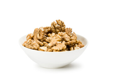 Shelled walnuts into bowl on white background.