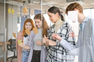 students discuss university assignments together