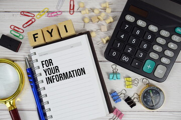 FYI - For Your Information acronym on notepad, Business and Financial concept background