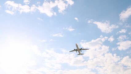 ULTRA HD. Airplane flies in blue sky. Travel. Airplane takes off against the background of blue sky. 