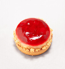 tart with cherry on a white background