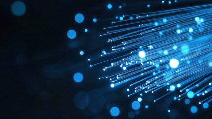 Blue fiber optic cables with light effects and bokeh on dark background. Telecommunications industry, internet providers, technology innovation campaigns