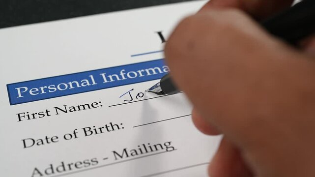 Filling up an application form with a pen.