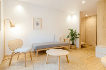 A serene, minimalist living room featuring soft colors and natural light.