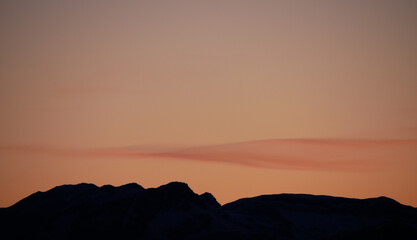 Dawn in the mountains decorated with a delicate cloud