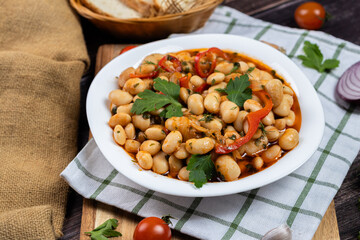 Lobio is a dish of Georgian, Azerbaijani and Armenian cuisines made from green bean pods. Traditional Georgian cuisine lobio. Lean dish. Lobio with pepper, onion. Side view.