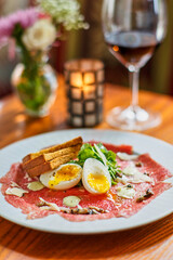 beef carpaccio with soft boiled eggs