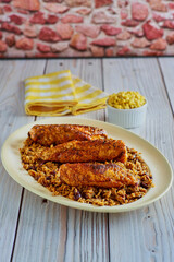 blackened monkfish served with dirty rice