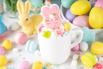 Fototapeta premium Easter holiday hot chocolate with funny bunny rabbits creative made with marshmallows, greeting card, child morning party invitation, Easter hot drinks menu background