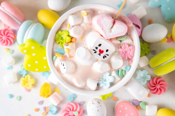 Easter holiday  hot chocolate with funny bunny rabbits creative made with marshmallows, greeting card, child morning party invitation, Easter hot drinks menu background